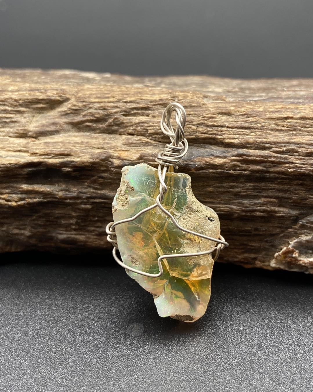 Raw opal with silver pendants