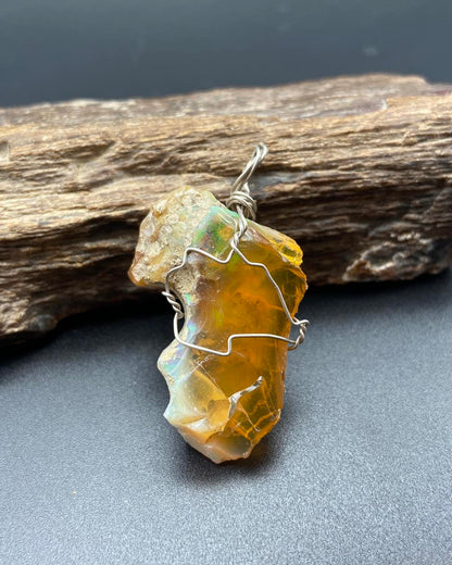 Raw opal with silver pendants